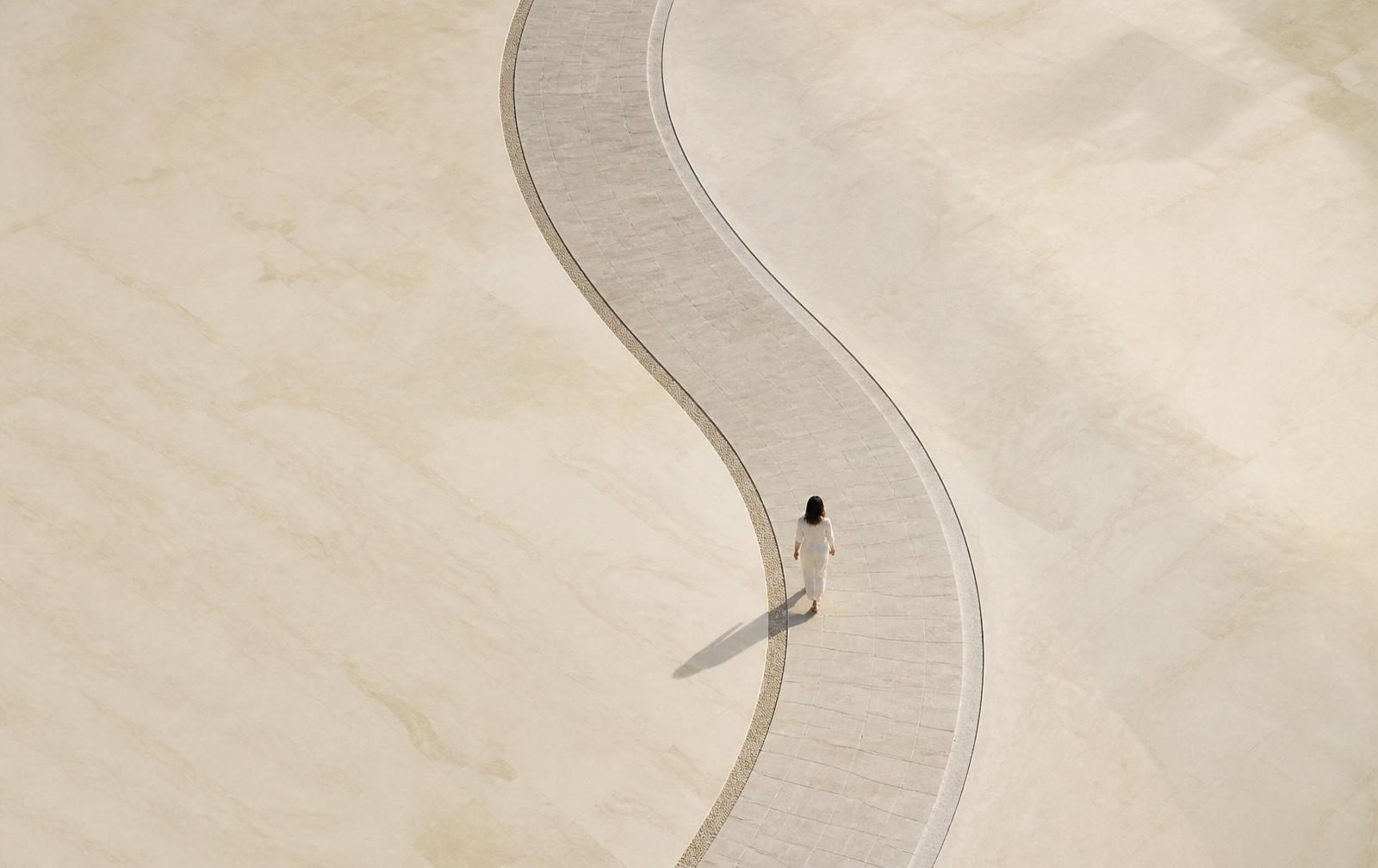 A single line curving through pristine space — a metaphor for the redesign journey